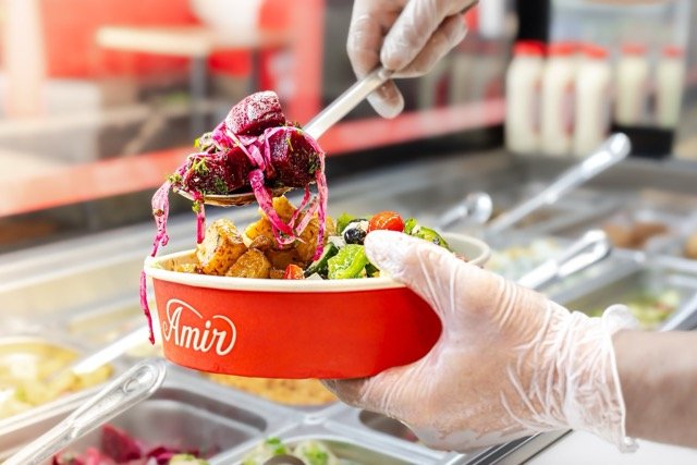 Amir food photography showing a chicken pita sandwich.